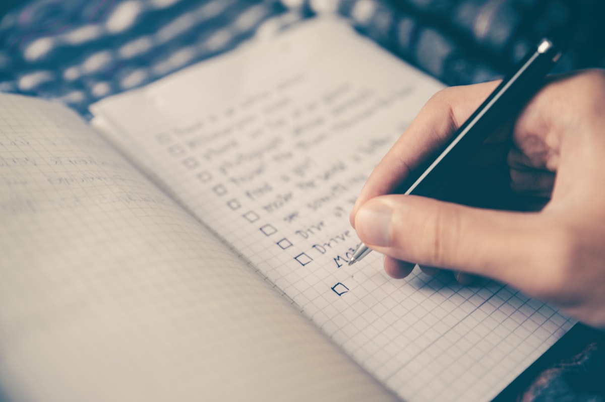 Organized productivity workspace with checklist and coffee
